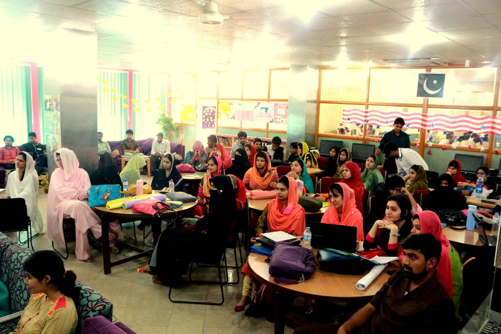 Ghulam Sarwar training participants in a computer lab at Lincoln Corner Bahawalpur